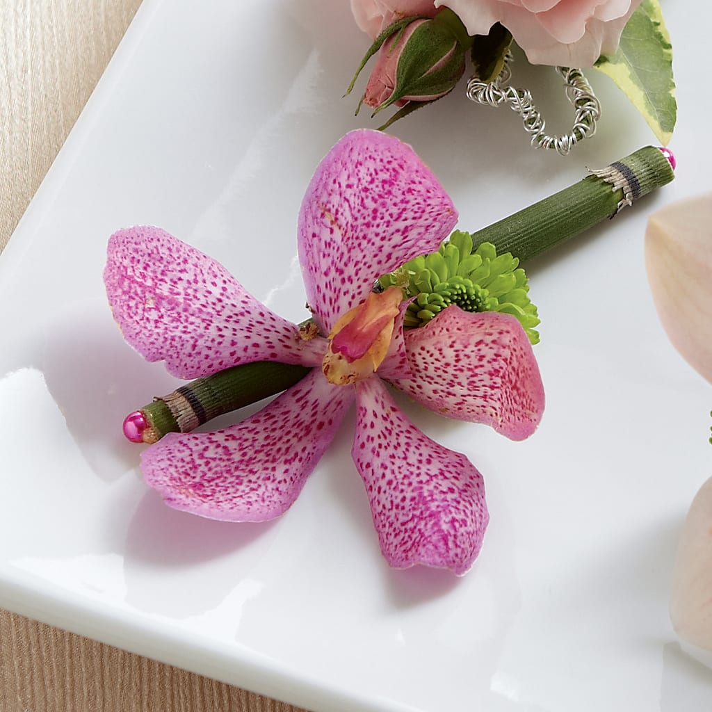 Pink Mokara Boutonniere – Guru Flowers, Port Saint Lucie FL